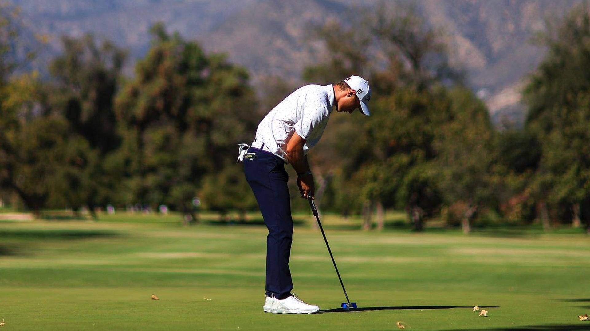 Tim Widing on green putting into the cup