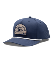 Bear Country Rope Hat in New Indigo, side view featuring a navy structured cap with a woven bear patch reading "Straight Down Clothing Company, San Luis Obispo, CA Since 1989" on the front panel, with a white rope brim detail