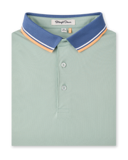 Chorro Polo in Herb featuring a blue contrast collar with white and orange stripe detailing.