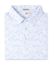 Folded South Beach Polo in Blue Shade, featuring a white base with a light blue coastal-inspired print and three-button placket.