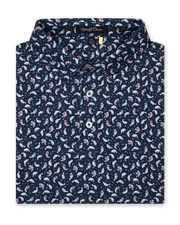Men's Manatee County Polo in New Indigo, folded flat lay front view featuring a navy short sleeve polo with an all-over scattered golf-playing manatee print in white and pink