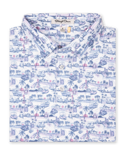 Folded white polo with blue and pink tropical golf print showing collar and placket