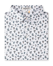 Folded white Siesta Polo featuring an allover Western-inspired print with golfers, cacti, sombreros, and desert motifs.