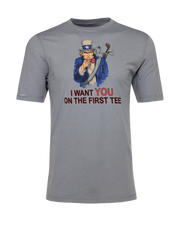 Men's Uncle Sam Graphic Tee in Grey, flat lay front view featuring a gray short-sleeve crew neck tee with a patriotic Uncle Sam pointing forward with a golf bag on his back and the text "I Want YOU On The First Tee"