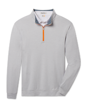 Palmer Quarter Zip in Heather featuring light gray heathered fabric, a stand collar, long sleeves, and a bright orange quarter-zip closure.