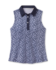 Women's Huli Sleeveless Polo in New Indigo featuring an allover tropical leaf and floral print in soft lavender tones on a deep indigo background, with a solid indigo collar
