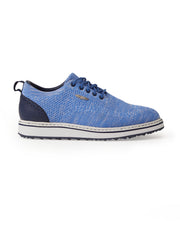 Men's Riviera Knit Oxford Shoe in Maison, lateral side view featuring a heathered blue knit upper with navy laces, a navy leather heel counter with brogue-style perforations, a white midsole, and a navy textured outsole