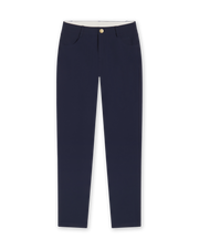 Women's Stride Pant in New Indigo, flat lay front view featuring solid navy fabric, front hip pockets, gold logo button closure, and a tapered leg
