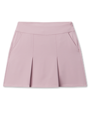 Korra Skort in Pink Dawn featuring a soft pink hue, front pleats, and side pockets