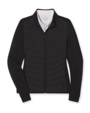 Women's Ida Hybrid Jacket in Black, flat lay front view featuring a hybrid construction with a quilted chevron-pattern front body and solid stretch sleeves, full zip closure, stand-up collar, and ribbed cuffs, layered over a white collared shirt