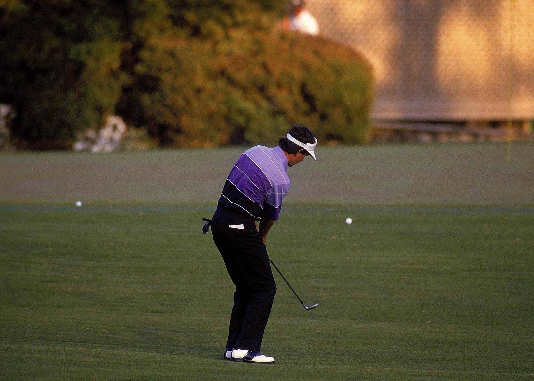 A vintage photo of Larry Mize executing his famous chip-in at Augusta during the 1987 Masters