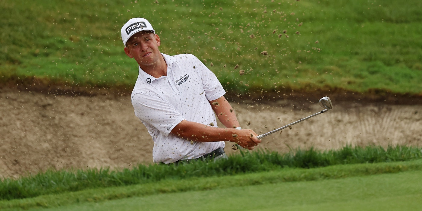 Sam Stevens blasts out of a bunker wearing a Straight Down printed polo