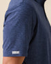 Close-up sleeve detail of Dodge Polo in Navy with woven logo tab