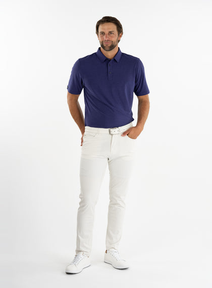 Dodge Polo in Dark Indigo, full-body model view styled with light pants