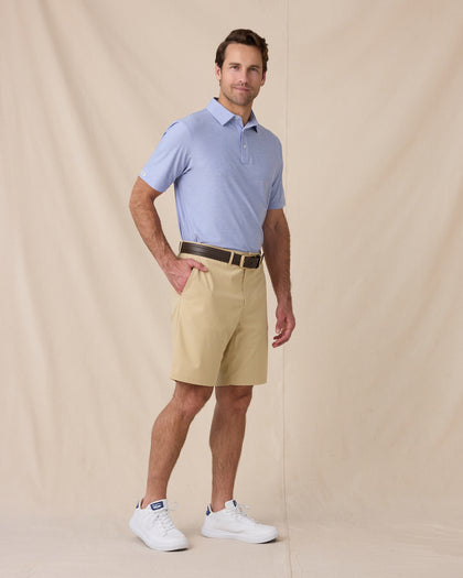 Dodge Polo in Blue Shade, full-body model lifestyle view styled with shorts