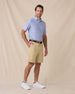 Dodge Polo in Blue Shade, full-body model lifestyle view styled with shorts