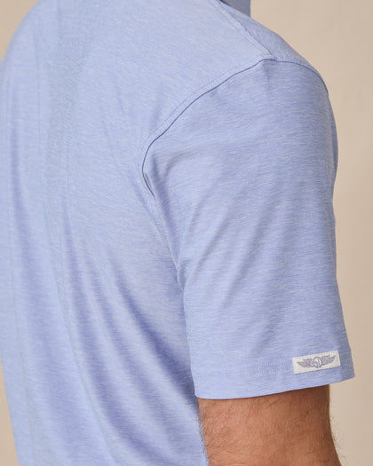 Close-up sleeve detail of Dodge Polo in Blue Shade with woven logo tab