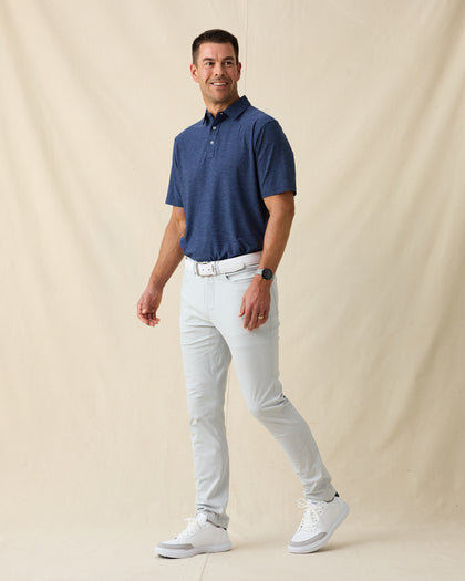 Dodge Polo in Navy, full-body model lifestyle view styled with light pants