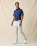 Dodge Polo in Navy, full-body model lifestyle view styled with light pants