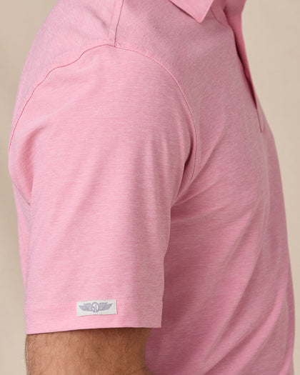 Close-up sleeve detail of Dodge Polo in Pink with woven logo tab