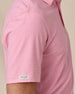 Close-up sleeve detail of Dodge Polo in Pink with woven logo tab