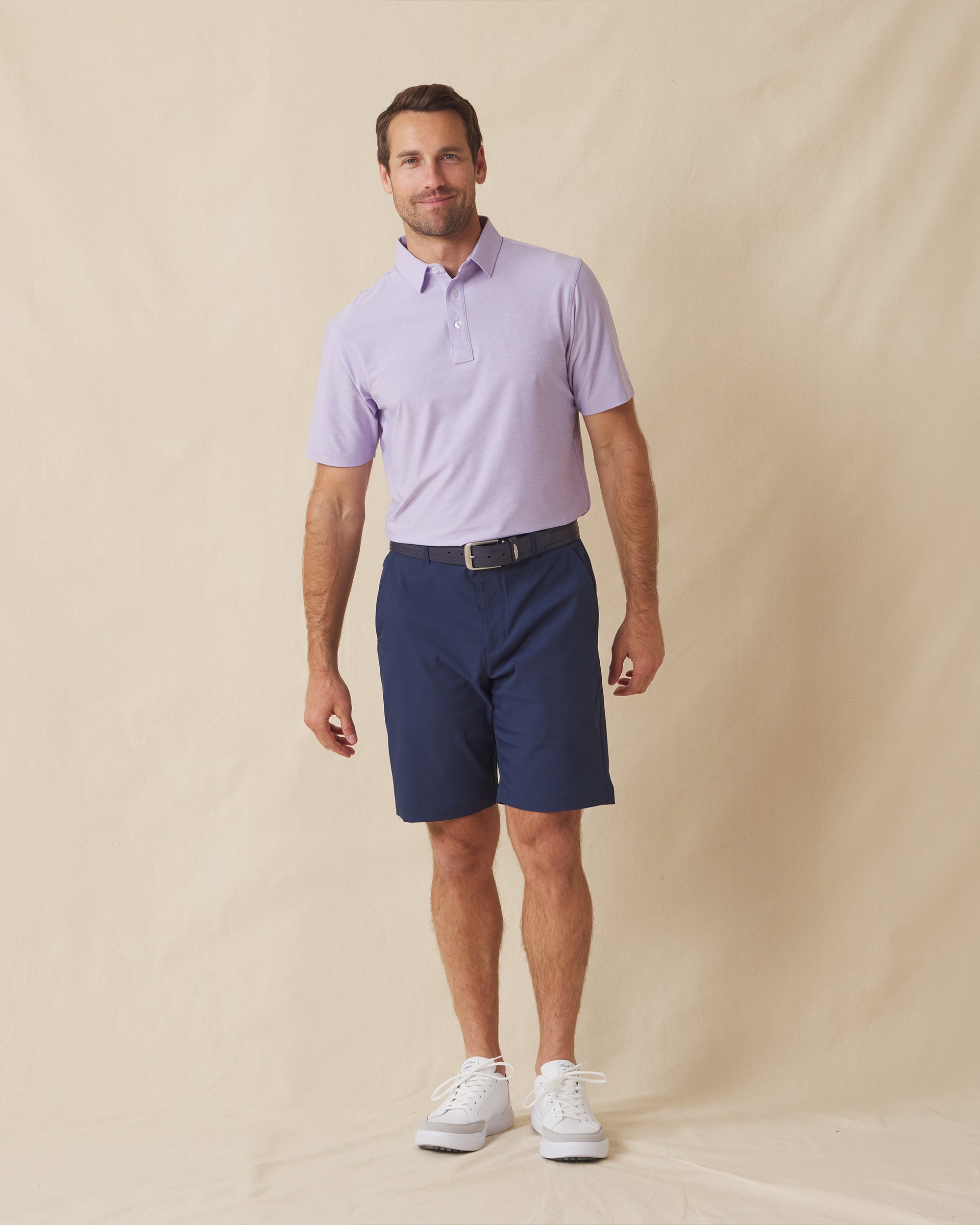Dodge Polo in Violet, full-body model lifestyle view styled with dark shorts