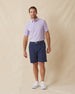 Dodge Polo in Violet, full-body model lifestyle view styled with dark shorts
