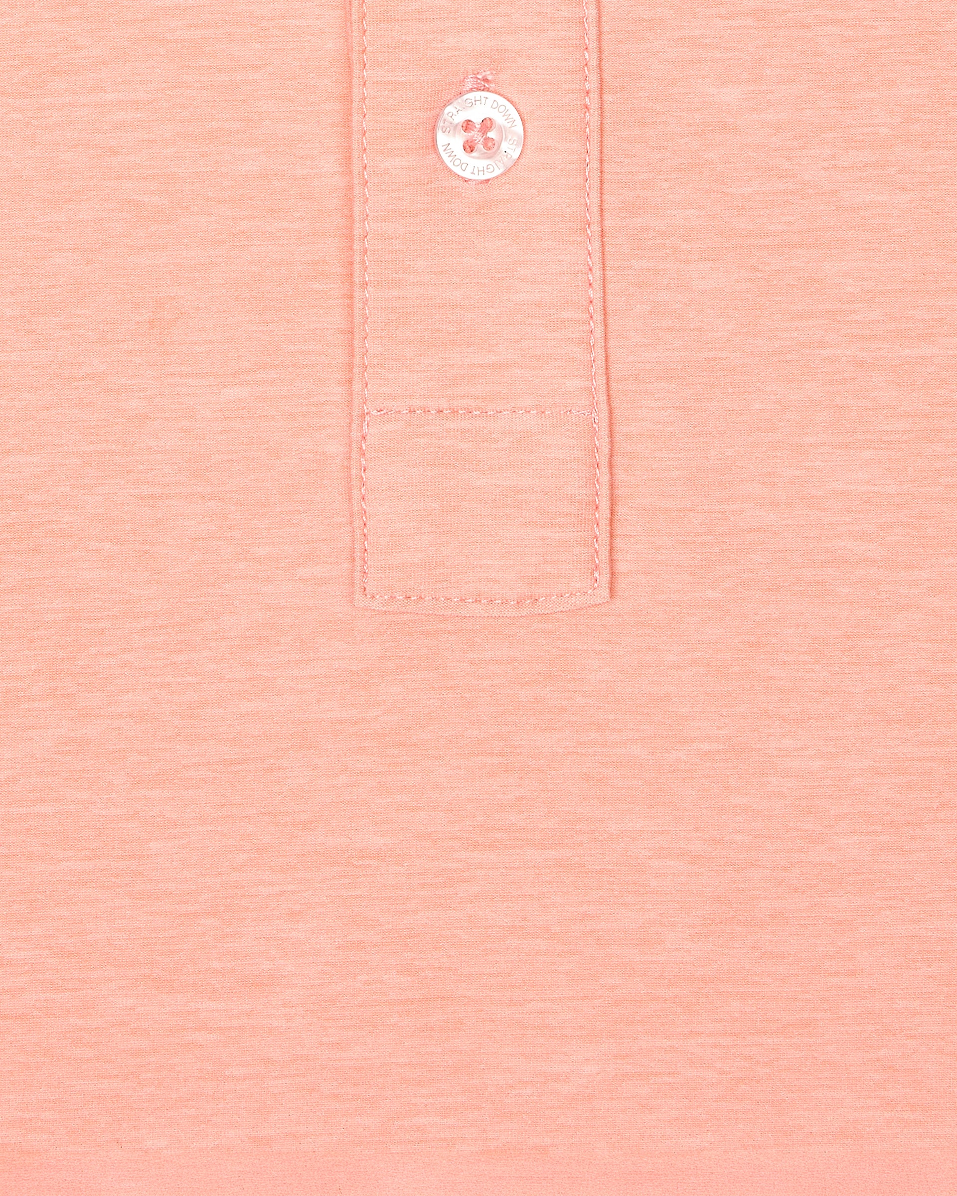 Close-up fabric texture and button placket detail of Dodge Polo in Spritz Orange
