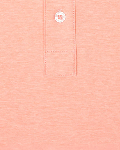 Close-up fabric texture and button placket detail of Dodge Polo in Spritz Orange