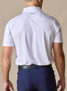 Men’s Olympic Polo in White, back view worn with navy golf pants
