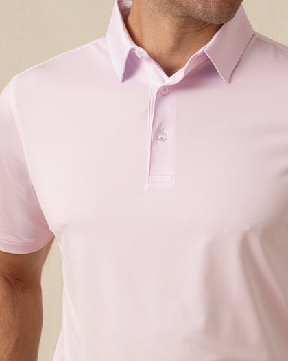Close-up of men’s lilac polo collar and button placket with clean, minimal design