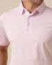 Close-up of men’s lilac polo collar and button placket with clean, minimal design