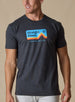 Straight Down Starsky Tee in Charcoal, on model front view showing charcoal heather crew neck with retro mountain graphic and Crafted for Life text paired with white pants