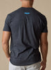 Straight Down Starsky Tee in Charcoal, on model back view showing charcoal heather body with blue Straight Down wings logo at upper back
