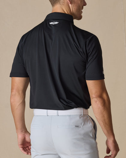 Back view of the Sullivan Polo in Black with signature logo detail below the collar in white