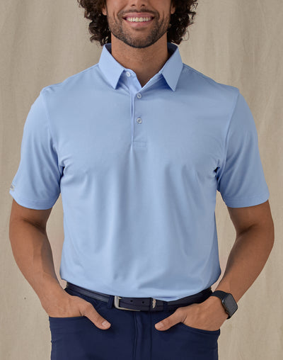 Men’s Sullivan Polo in Carolina Blue, front view worn with navy golf pants