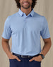 Men’s Sullivan Polo in Carolina Blue, front view worn with navy golf pants