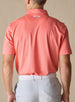 Back view of the Sullivan Polo in gala orange with signature logo detail below the collar