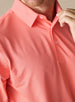Close-up of the Sullivan Polo in gala orange featuring a smooth performance fabric and structured collar