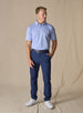 Men’s Sullivan Polo in lavender, full-body styling view with navy golf pants