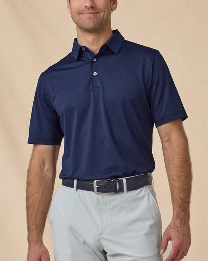 Men’s Sullivan Polo in New Indigo styled with khaki golf pants, front view