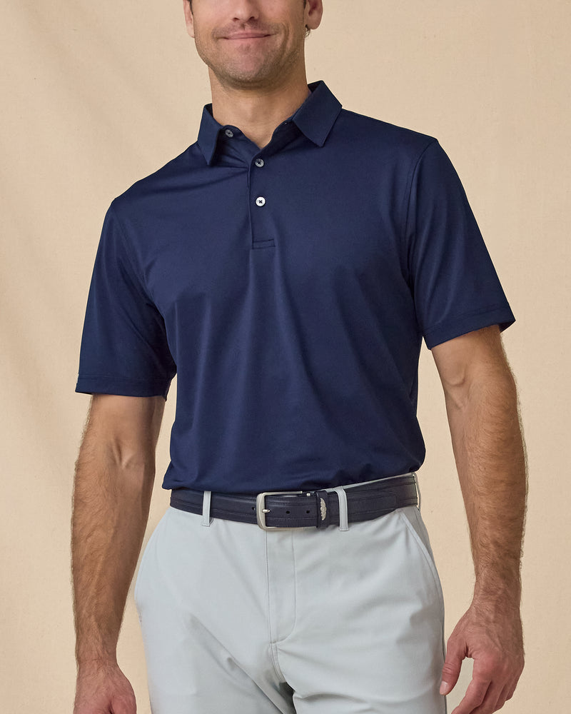 Men’s Sullivan Polo in New Indigo styled with khaki golf pants, front view