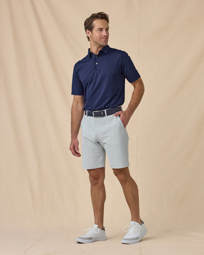 Full-body view of the Sullivan Polo in New Indigo paired with khaki pants