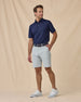 Full-body view of the Sullivan Polo in New Indigo paired with khaki pants