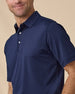 Close-up detail of the Sullivan Polo in New Indigo highlighting the textured performance fabric, collar, and button placket