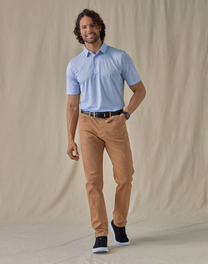 Men’s Sullivan Polo in Powder Blue, full-body styling view with khaki pants and dark sneakers