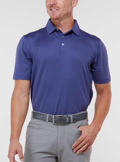 Men’s Sullivan Polo in skipper blue, front view worn with gray golf pants
