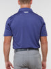 Men’s Sullivan Polo in skipper blue, back view worn with gray golf pants