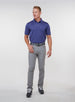 Men’s Sullivan Polo in skipper blue, full-body styling view with gray golf pants