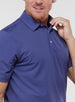 Men’s Sullivan Polo in skipper blue, close-up detail of collar and performance fabric